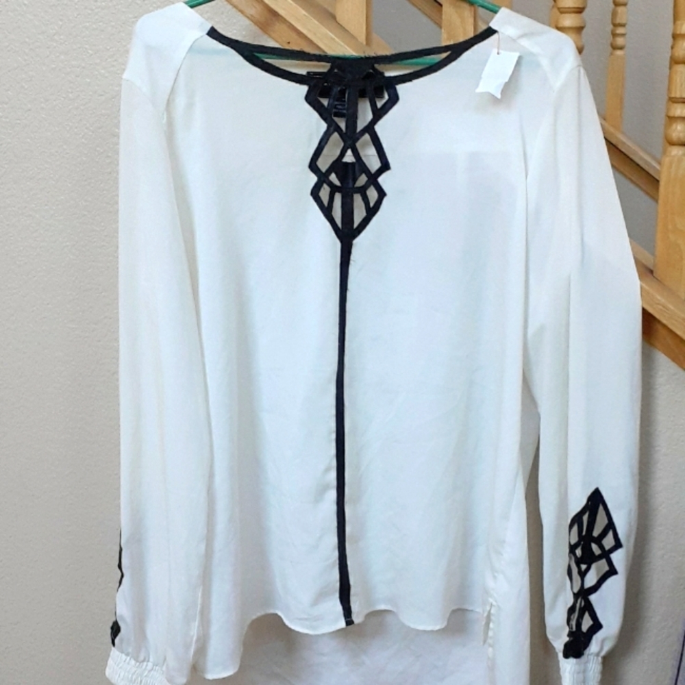 Long Sleeve 100% Polyester long sleeve blouse.  Medium.